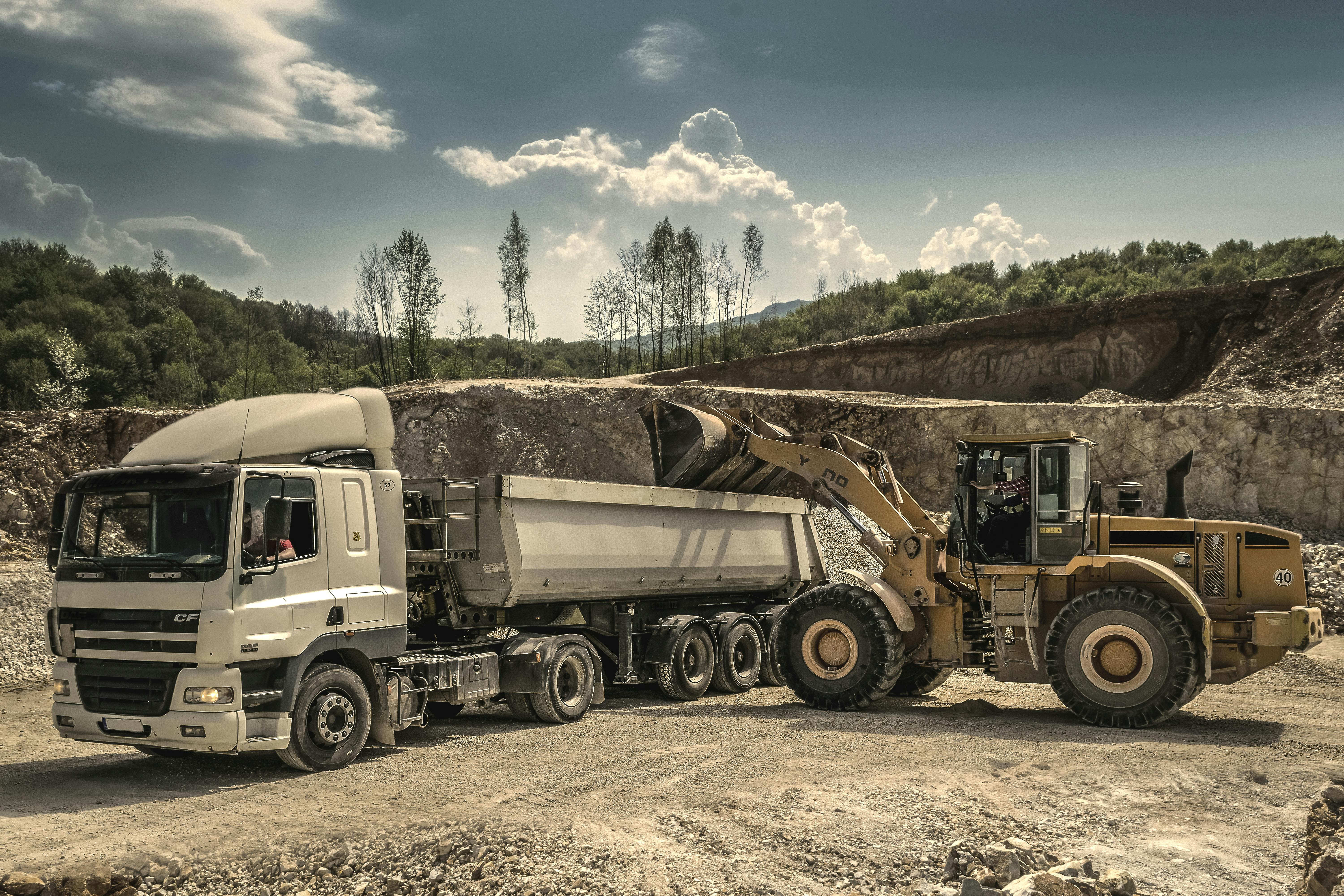 Mine-spec truck and loader on site